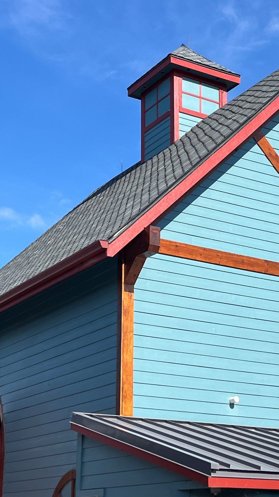 Shingle roof with cupola on a commercial building in Gatlinburg, TN by McGuire Roofing
