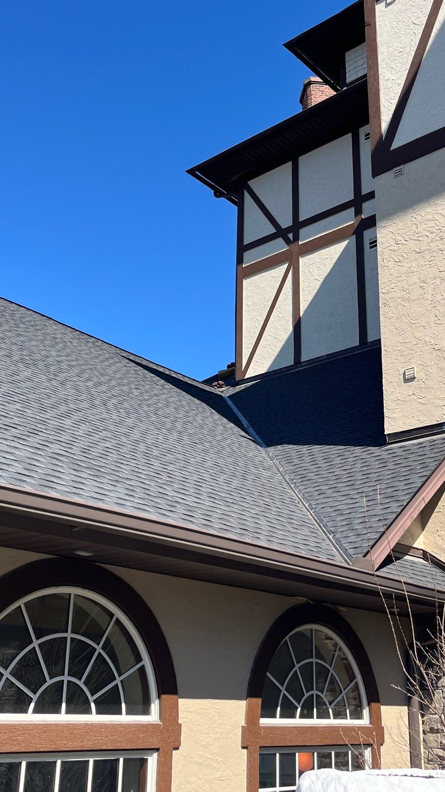 Shingle roof on a commercial building with arched windows in Pigeon Forge, TN by McGuire Roofing