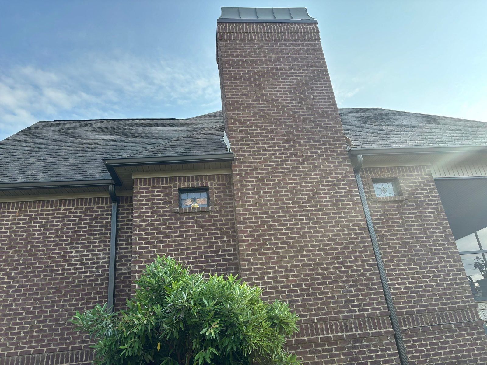 Shingle roof replacement on a brick home with chimney in Vonore, TN by McGuire Roofing