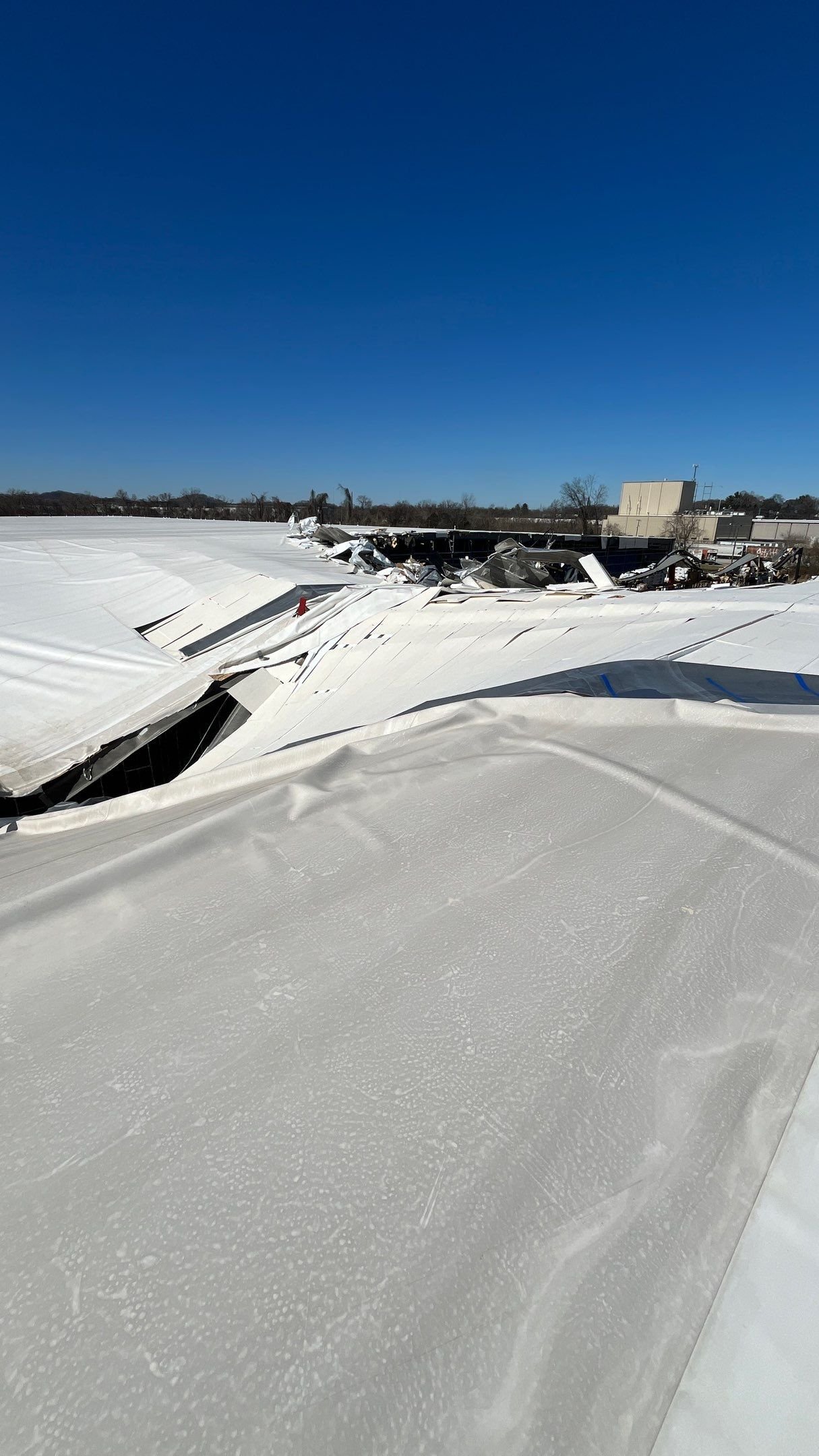 Snow load roof collapse on an industrial building with a TPO roof in Knoxville, TN